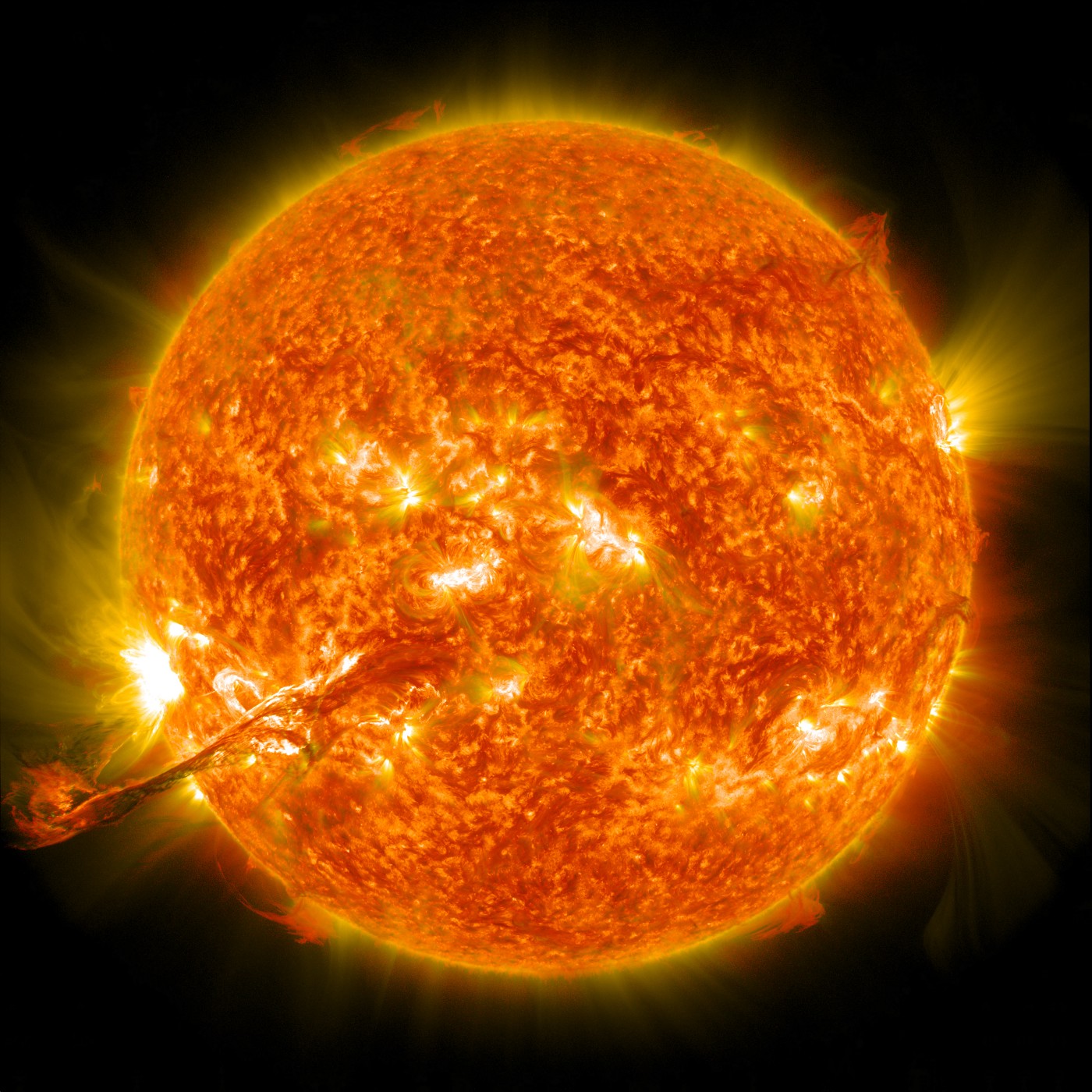 A close up of a fiery bright orange sun.
