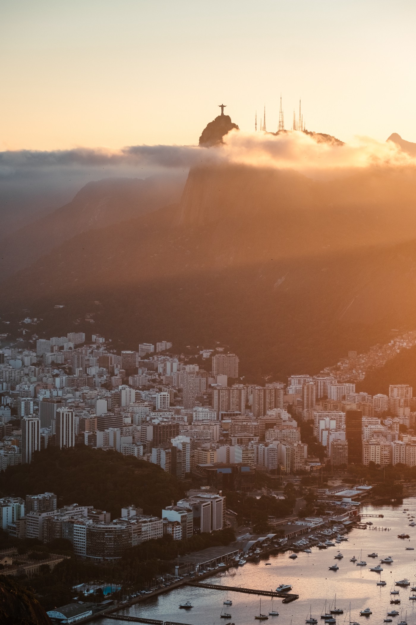 Rio de Janiero, Brazil as see from above. We see the Christ the Redeemer sculpture in the distance.