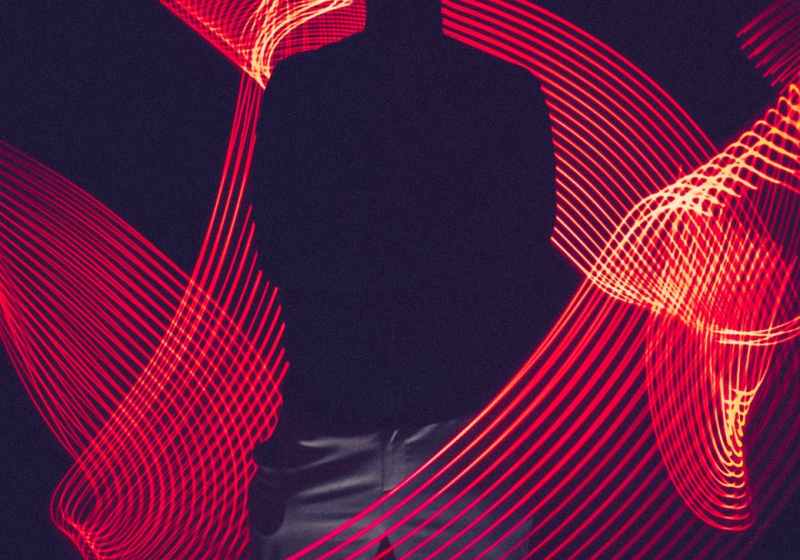 red led light with silhouette of a man
