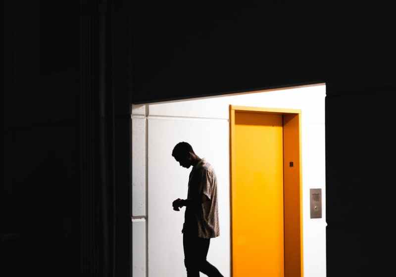man entering a dark room