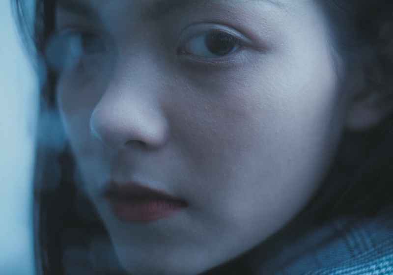 tender serious teen girl looking at camera