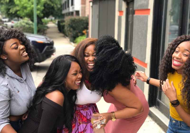 five women laughing