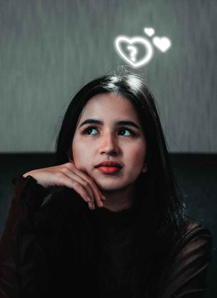 pensive woman looking up