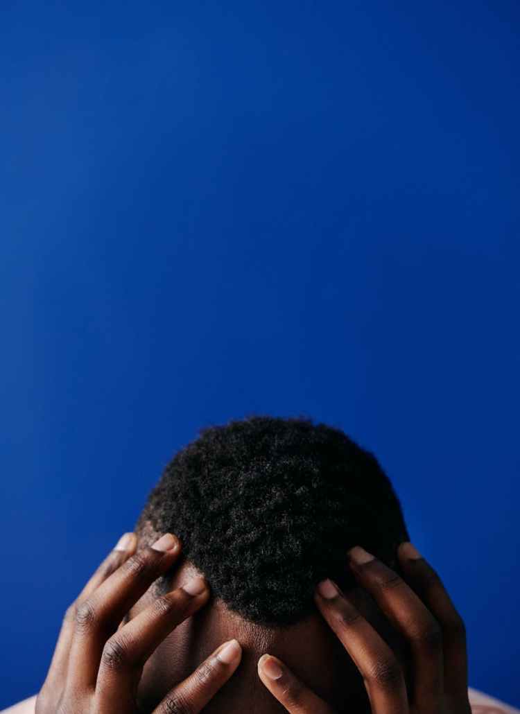 person covering face with hair