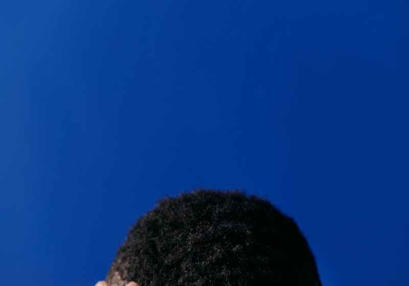 person covering face with hair