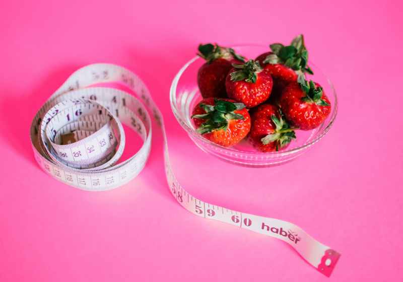 strawberries and measuring tape
