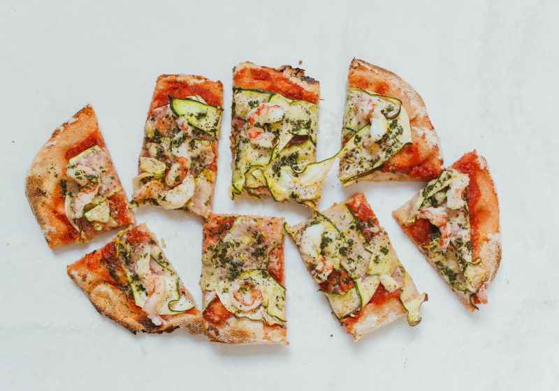 a top view of a sliced pizza