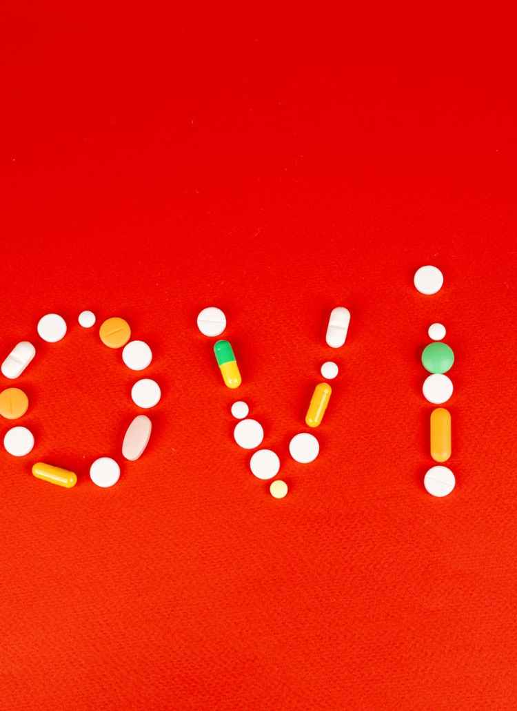 medicines on a red surface