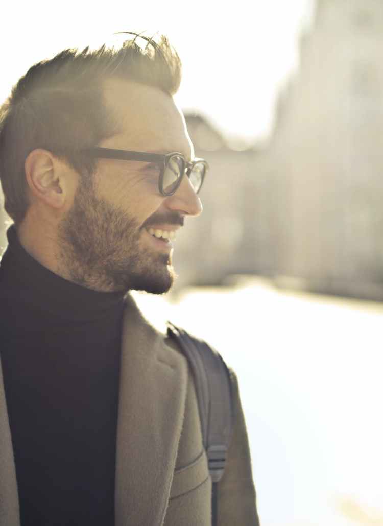 shallow focus photography of man wearing eyeglasses