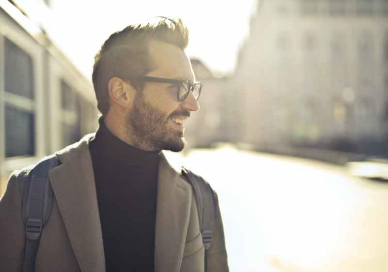shallow focus photography of man wearing eyeglasses