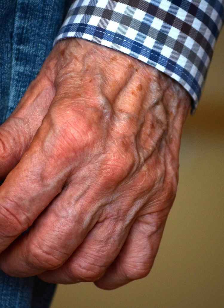 person in blue denim jeans