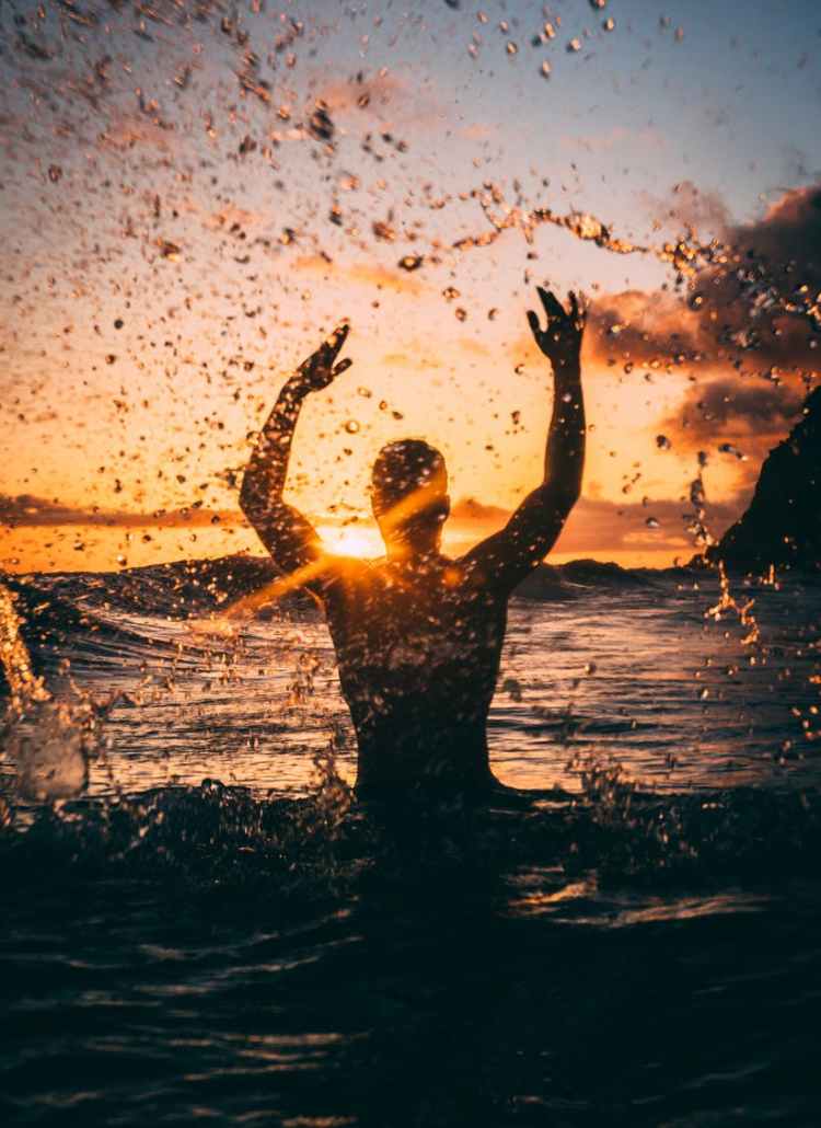 silhouette photography of man at beach during sunset