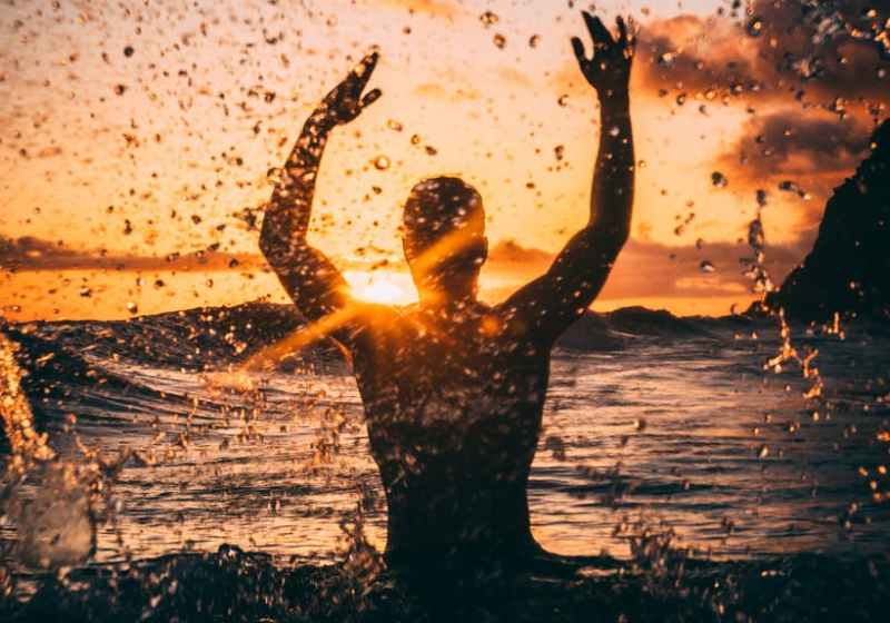 silhouette photography of man at beach during sunset