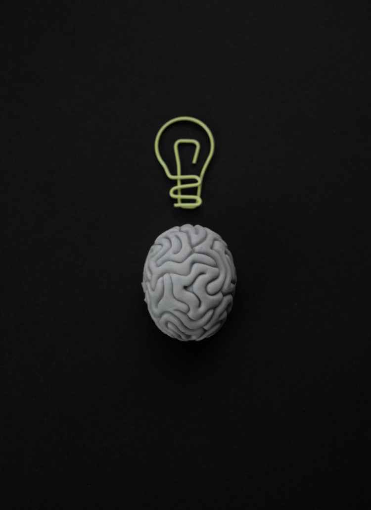brain shape eraser and a paper clip