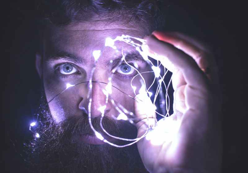 person holding string lights photo