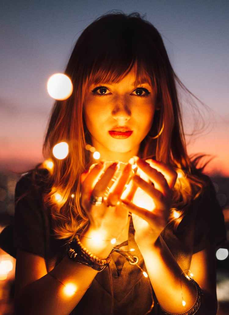 woman holding fireflies