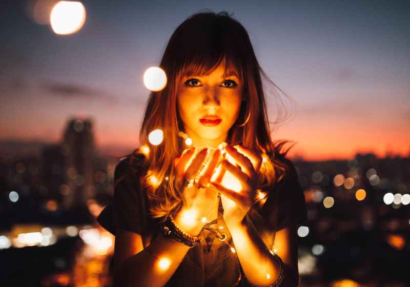 woman holding fireflies