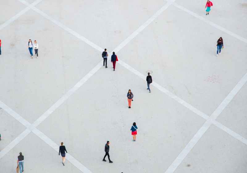 people walking on spacious concrete square