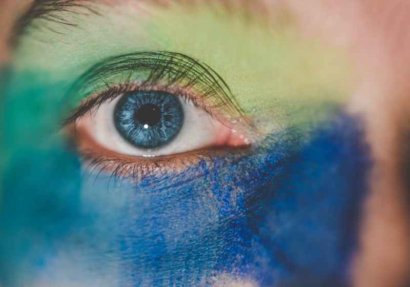 human eye with blue and green makeup