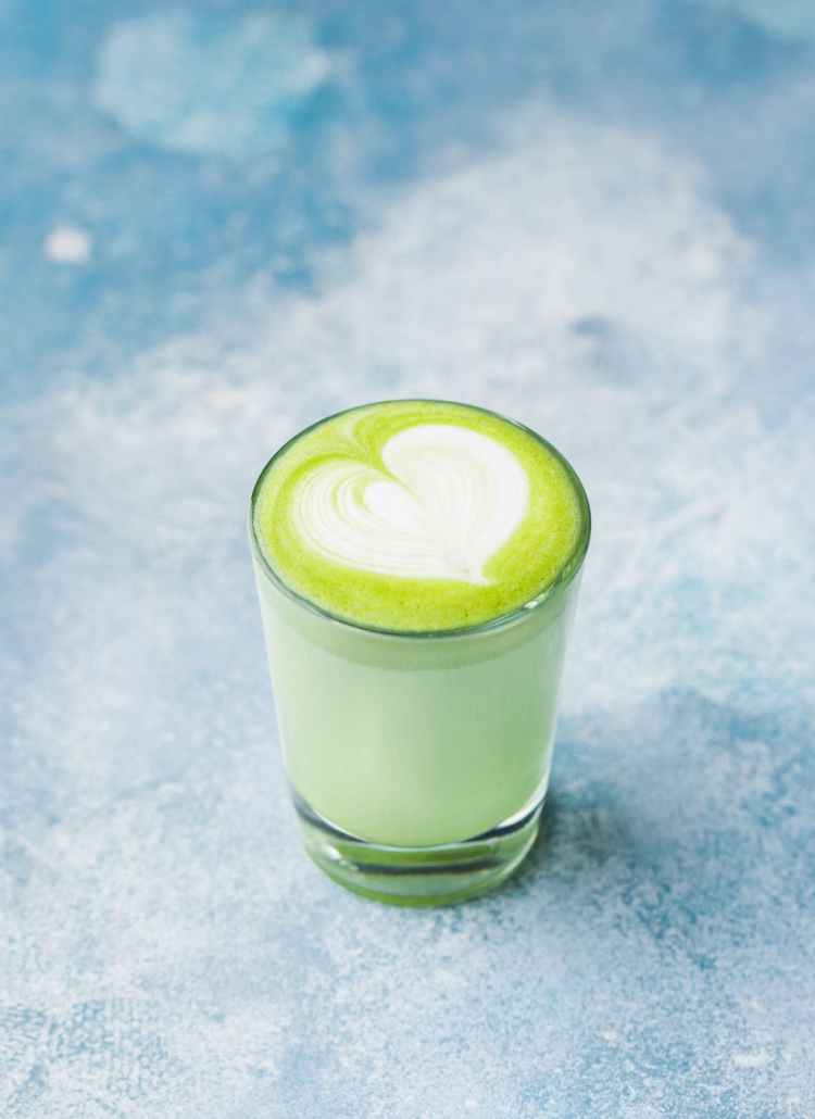 close up photo of glass of matcha drink