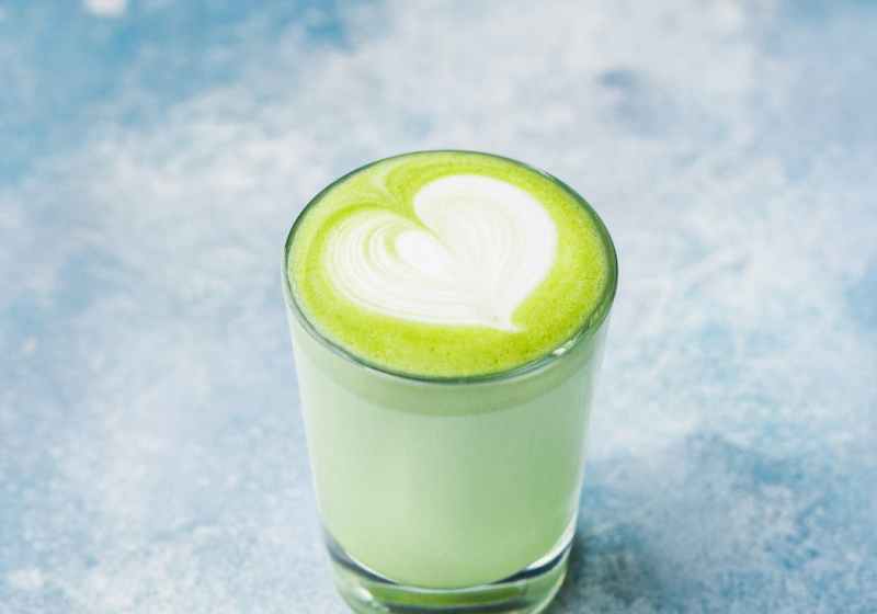 close up photo of glass of matcha drink