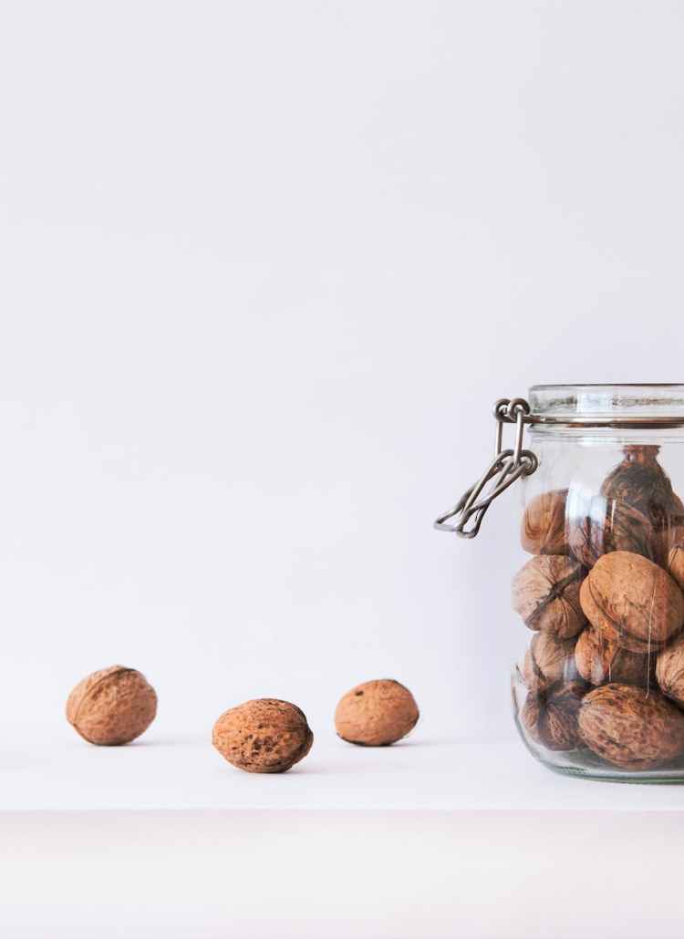 walnut in clear glass jar