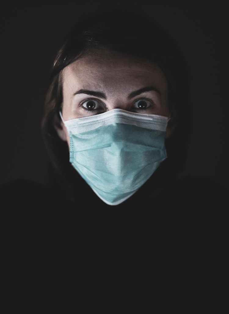 woman in blue and white face mask