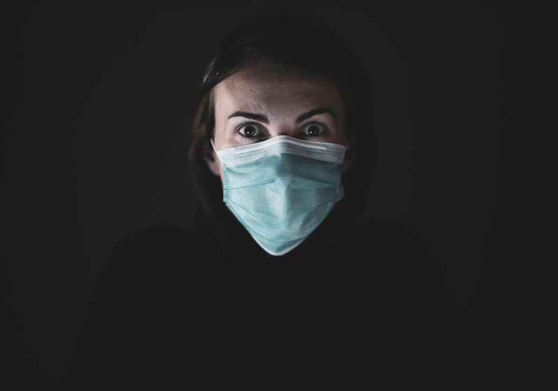 woman in blue and white face mask