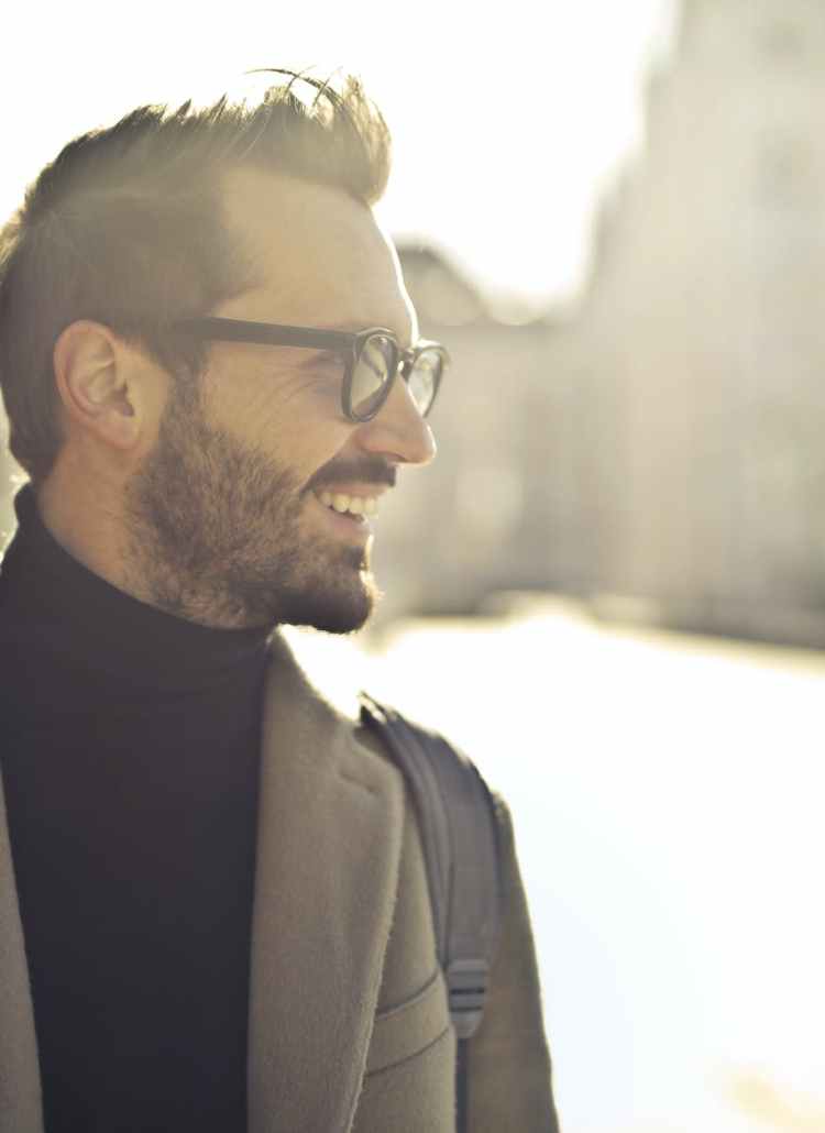 shallow focus photography of man wearing eyeglasses