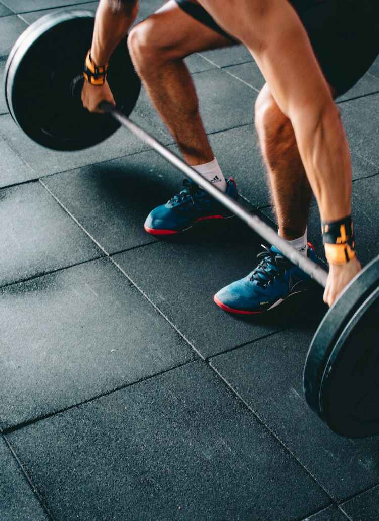 person holding barbell
