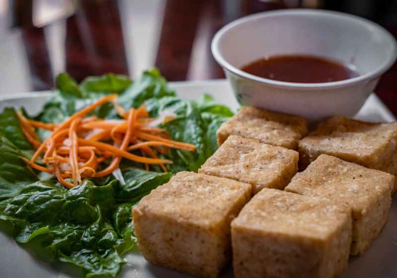 a close up shot of fried tofu