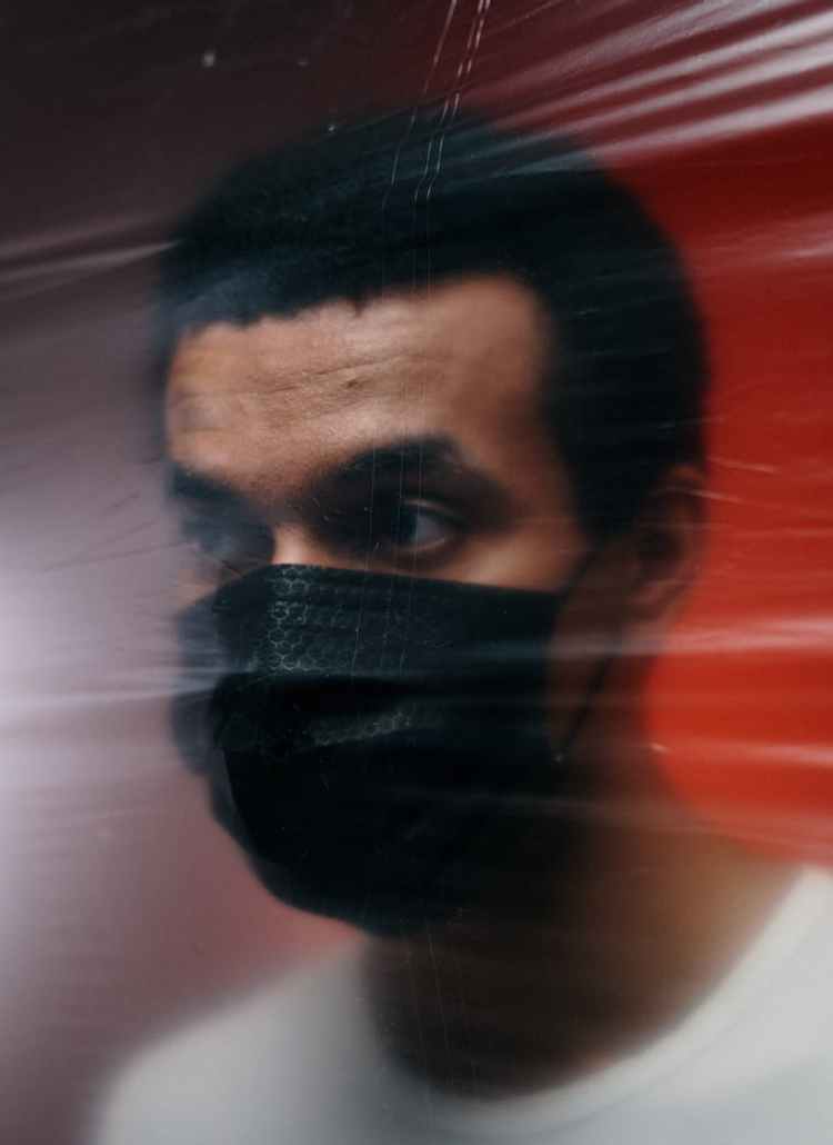 man wearing a black face mask