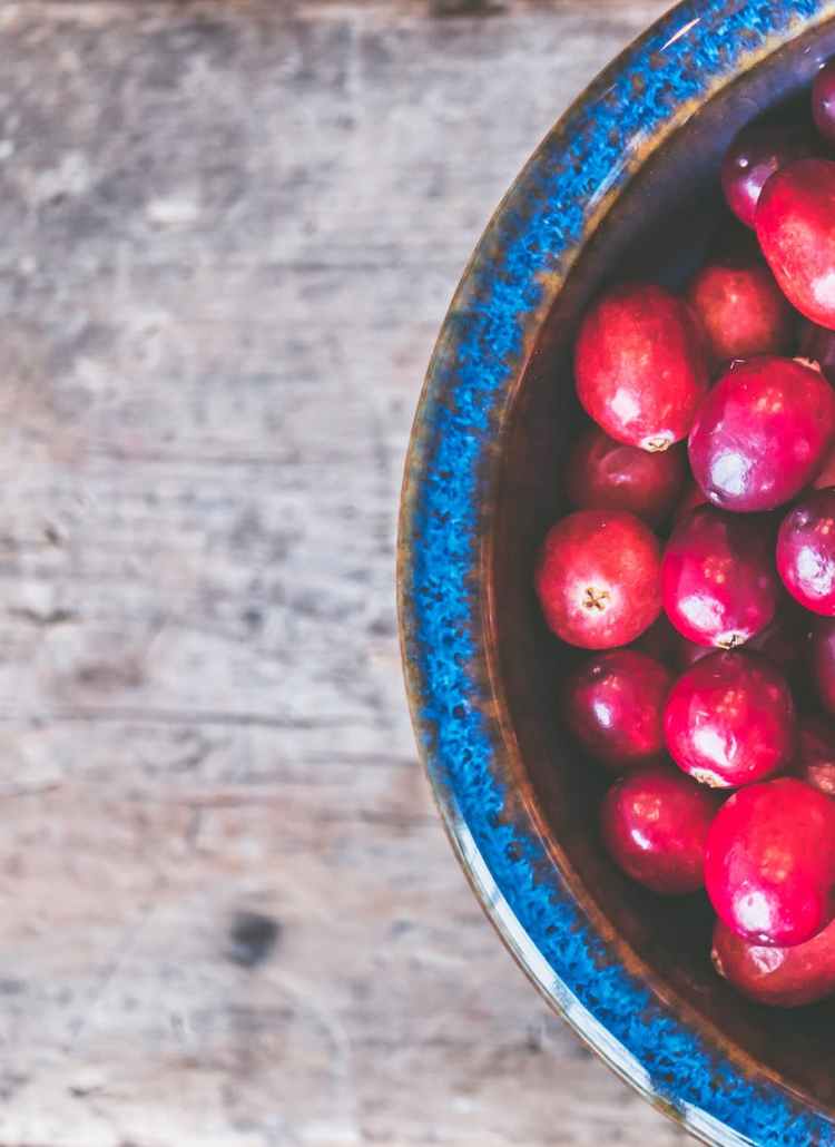 bowl of red round fruits