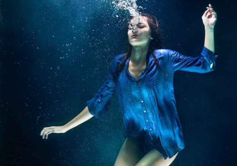 underwater photography of woman