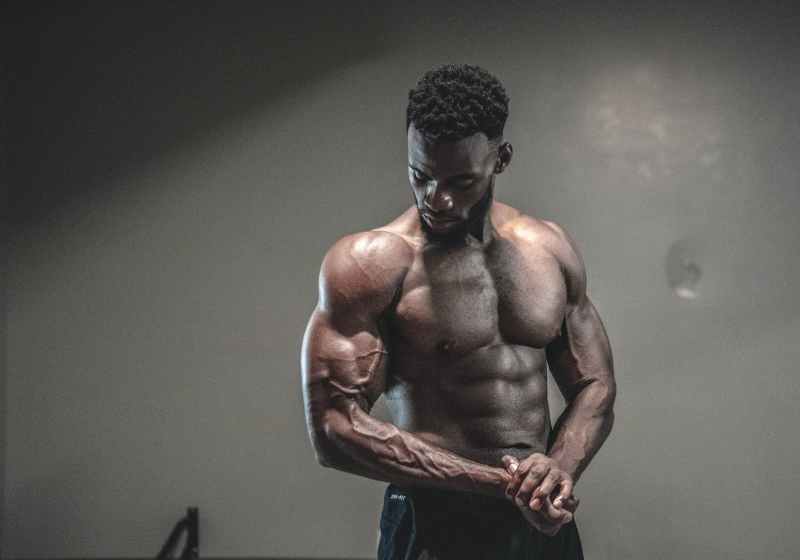 photo of man with muscular body