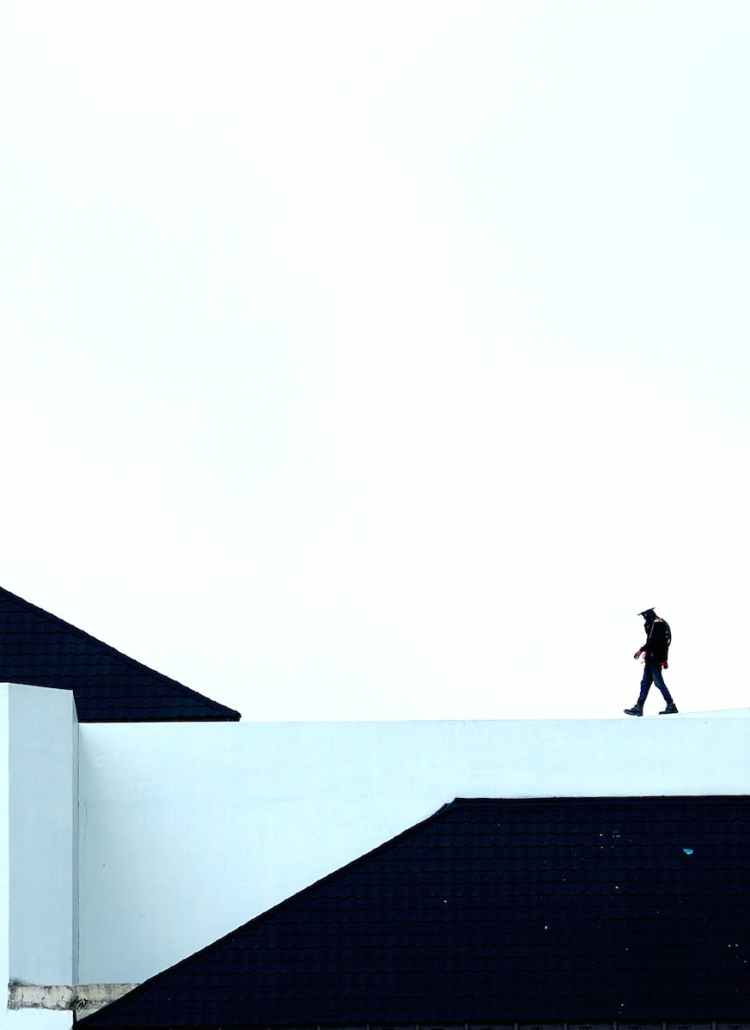 man walking on white platform