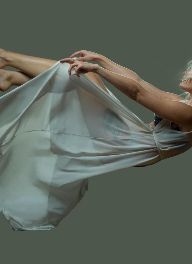 a falling woman wearing a sheer dress