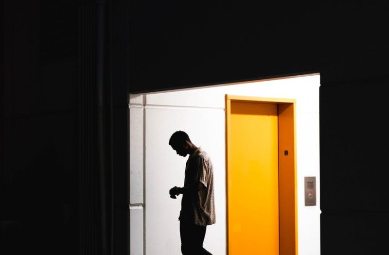 man entering a dark room